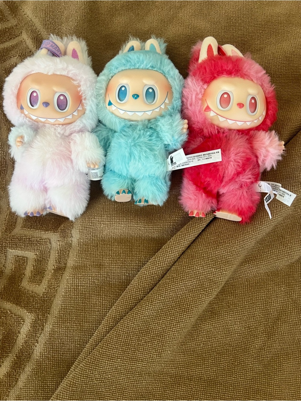 Labubus the monsters purple,blue,and red
